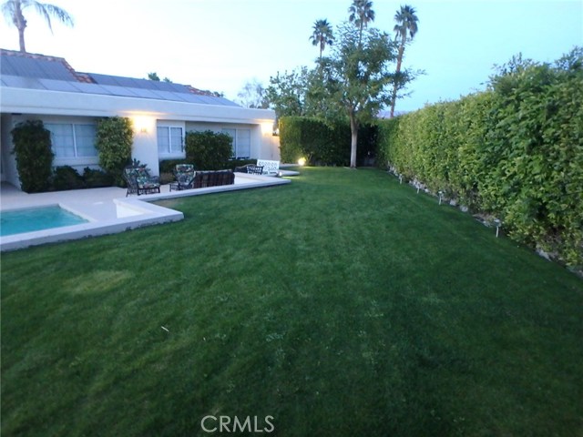 Grass area looking towards front gate and house.