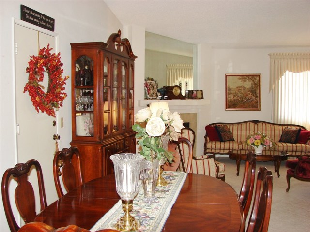 VIEW ACROSS FORMAL DINING AREA AND INTO LIVING ROOM.