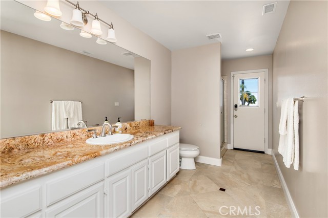 Large guest bathroom with pool access on lower level