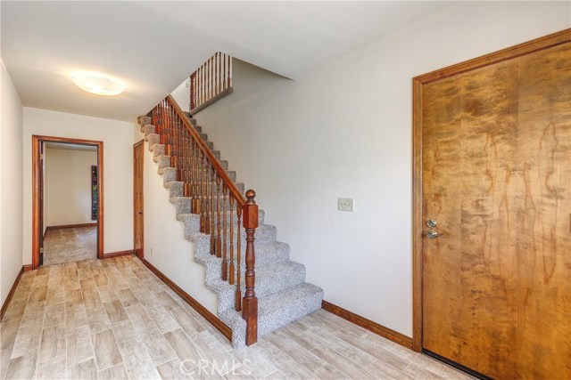 Entry, walkway to Bonus rooms, stairwell to Main floor (2nd level), door from garage