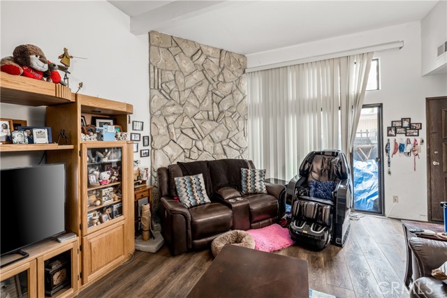 Living room -  that's a FIREPLACE behind the seating! Sliding doors lead to private patio.