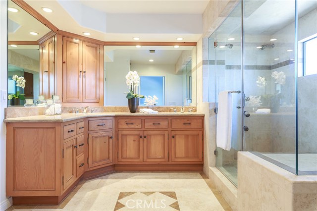 master bathroom, 2 sinks, multiple shower heard in the Steam shower