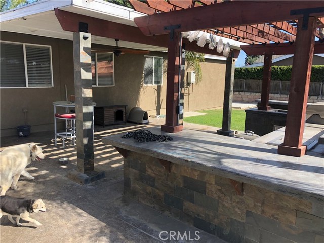 Back of house and built in BBQ/outdoor kitchen area.