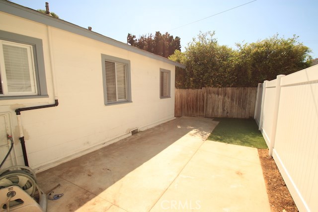 Back yard of the front house.  All newer vinyl fencing separates unit A & B yards.