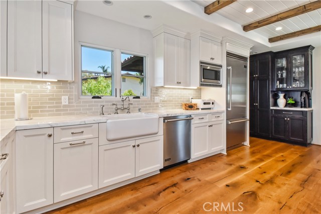 Custom Cabinetry and Calcutta Marble Counters