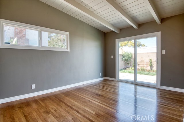 BACK BEDROOM (APPROX 10'6" W X 13'6" D + 2'X5' SECT NEAR CLOSET) ) LOOKING AT BACKYARD FLOWERS - NEW SLIDING GLASS DOOR