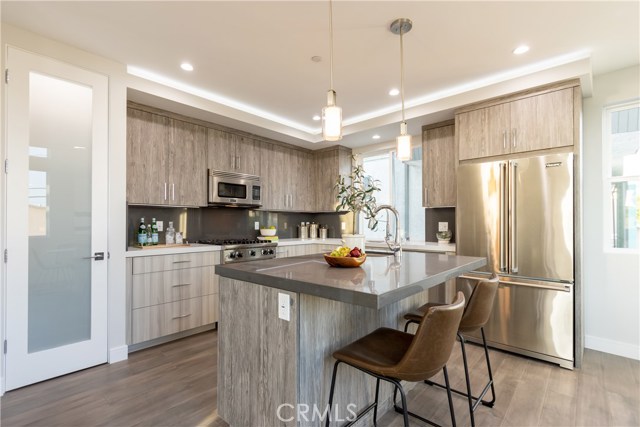 KITCHEN, ISLAND WITH PREP SINK AND SEATING