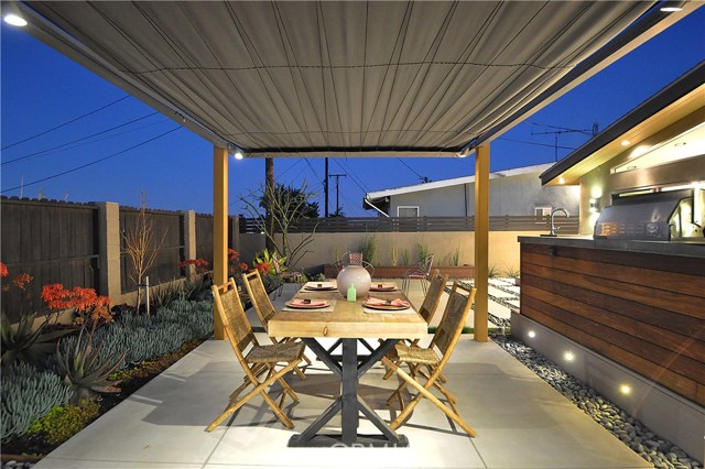 Enjoy outdoor dining under the custom made pergola