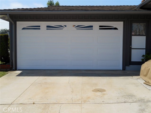 Roll-Up Sectional Door and Adjacent Man Door. No need to over work Garage Door.