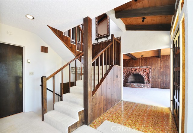 Interior staircase looking towards living room and front door