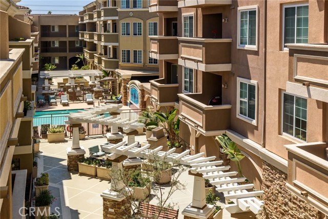 Courtyard view of pool and multiple outdoor common areas.