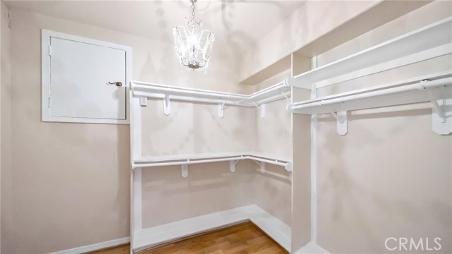 Large walk-in closet in finished bathroom.