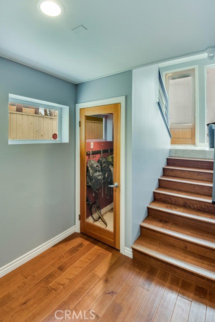 Storage area under stairs.  Perfect for wine!