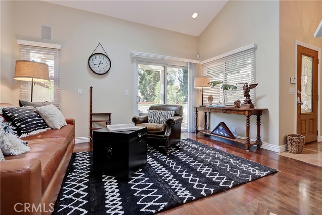 Bright, light, and open formal living room has easy access to enclosed outdoor patio.