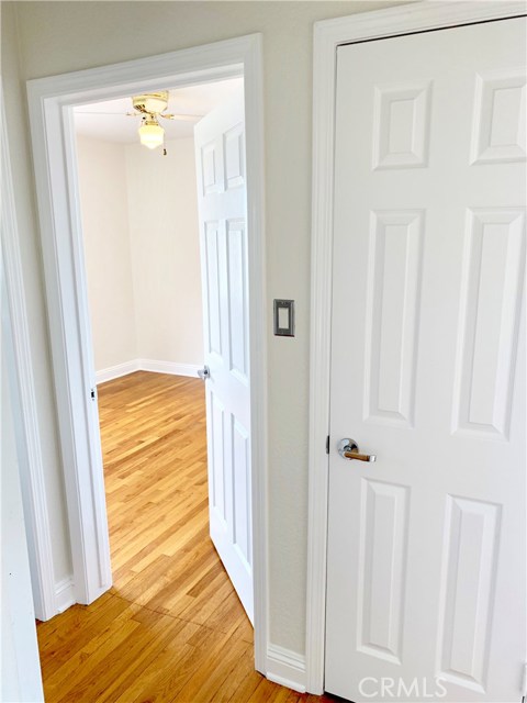 Hallway looking into second bedroom.