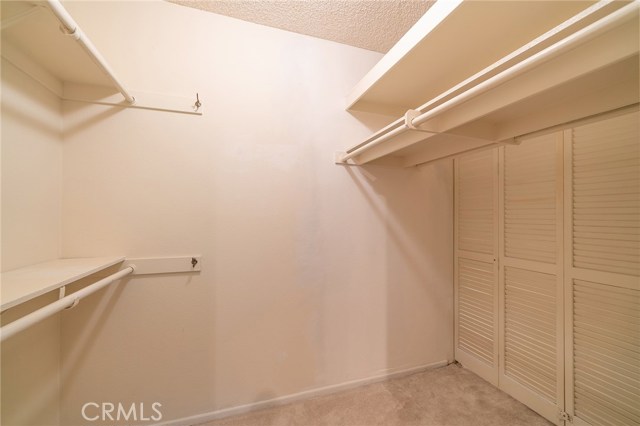 The walk in closet has double door entry on one side and a single door on the other for maximum use of space.