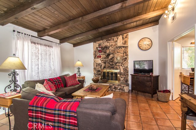 LIVING ROOM WITH SPANISH TILE FLOORING.