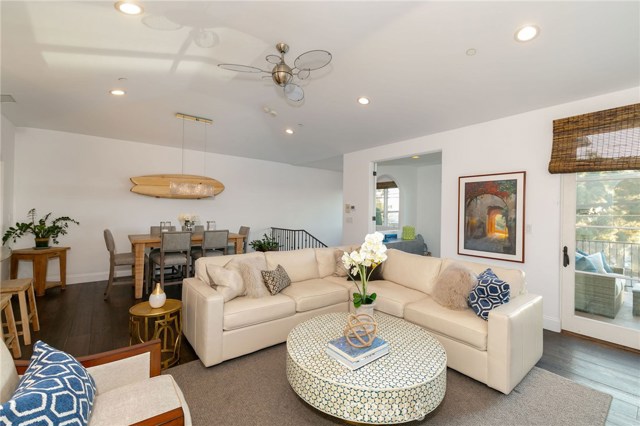 View of living room, dining room, office and outdoor deck