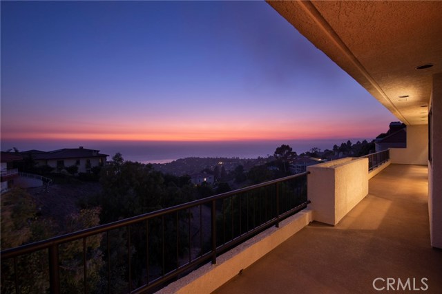 Sunset view from deck off family rm, kitchen, dining and living room