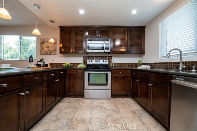 Good size kitchen with plenty of space for the family to cook together. Notice the beautiful views from all windows.