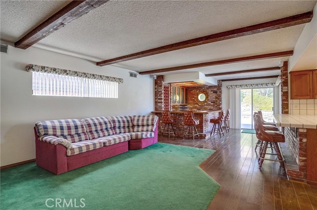 Great Room with family room, wet bar & kitchen