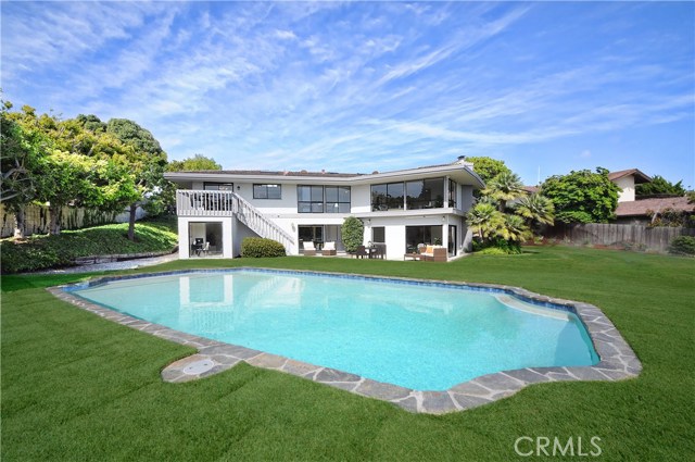 A new refinished pool in the large grassy backyard