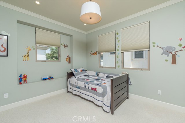Bedroom #3 has crown moldings and Berber carpeting.
