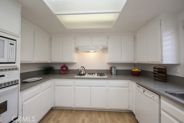 Kitchen with new Corian counters, plenty of work and storage space.