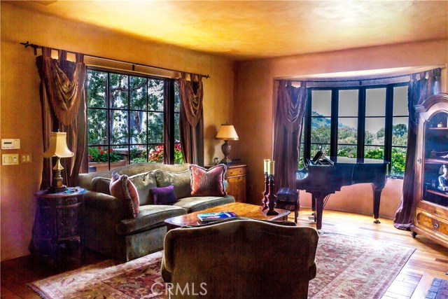 Living Room With Ocean And Hillside Views