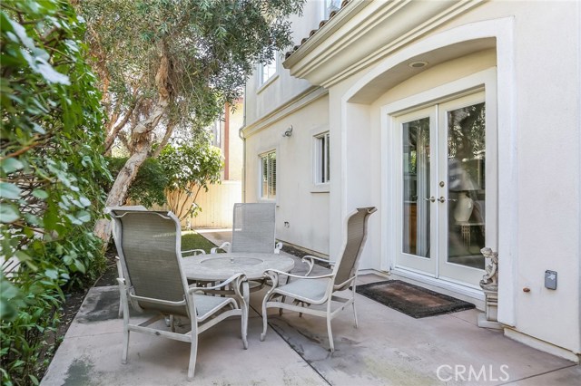 Private back yard patio off Family room French doors