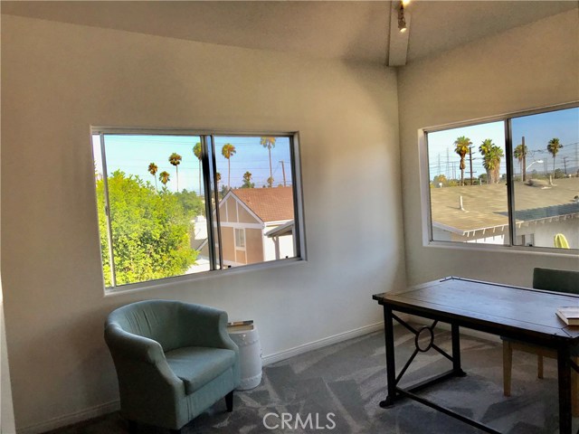 Bright and airy corner with city and palm tree views, as shown here, it's perfect home office for video-conferencing or bedroom. It's a luxury to have 4 spacious bedrooms all with vaulted high ceilings, corner locations and light coming from the two windows.