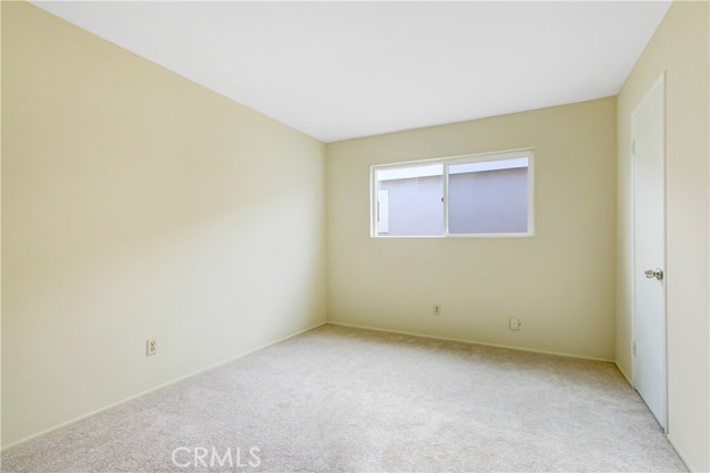 One of four bedrooms with new carpets, new window and just painted!! Small walk in closet.
