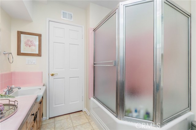 Bathroom #3 - With dual sinks and large bath with shower, the bathroom serves the lower level bedrooms and living spaces.