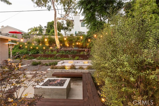 Views of the firepit, Ipe wood benches, lounge area and organic gardens