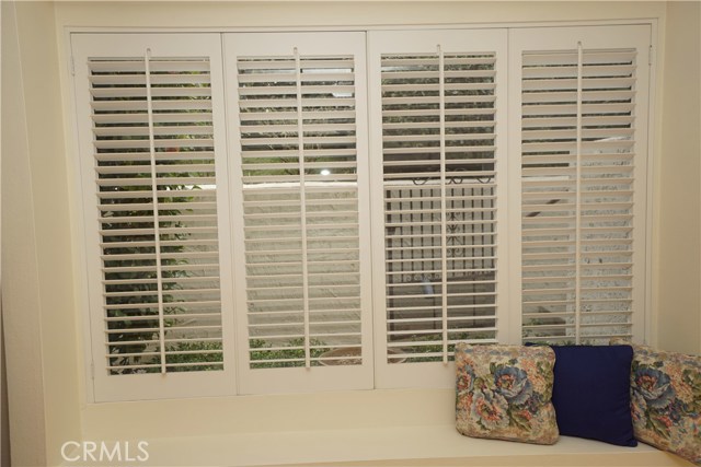 Dining room or family room combo. Window bench.  Plantation Shutters throughout home.