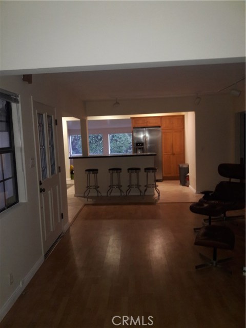 View from Family Room/ Great Room almost 50 Feet from Palos Verdes Stone Fireplace to Sunroom Windows.