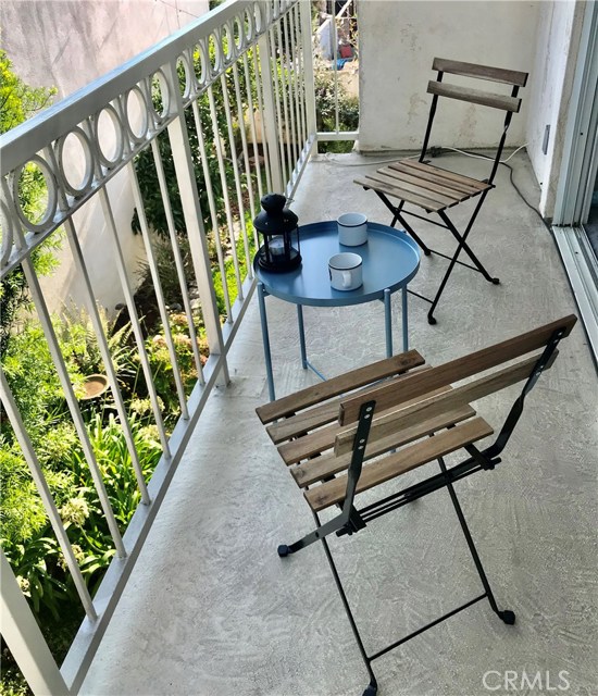 Step out to the balcony to enjoy a cup of coffee and the fresh morning air with the view of the backyard.