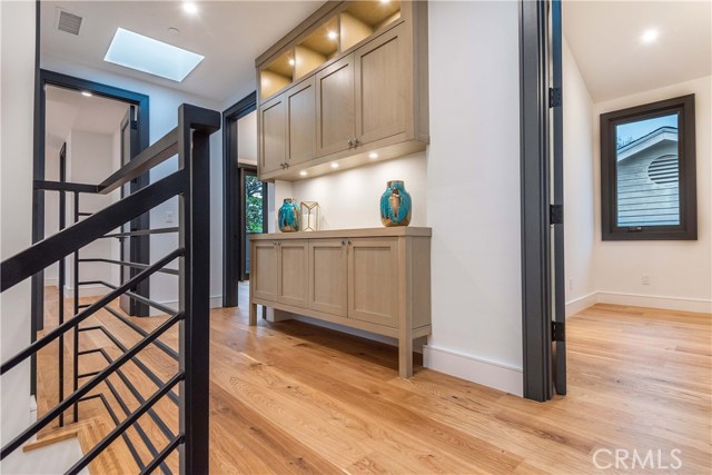 Note the high quality custom built in cabinet with discrete under cabinet lighting. Two skylights bring in an abundance of natural light.