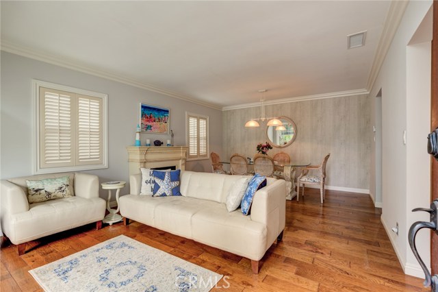 Living room with hardwood floors and fireplace