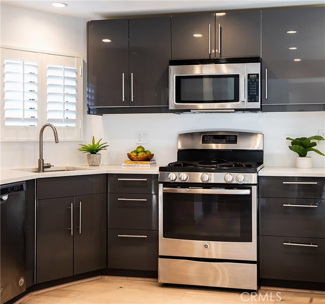 MODERN CABINETS AND DRAWERS PROVIDE TONS OF STORAGE IN THE KITCHEN.