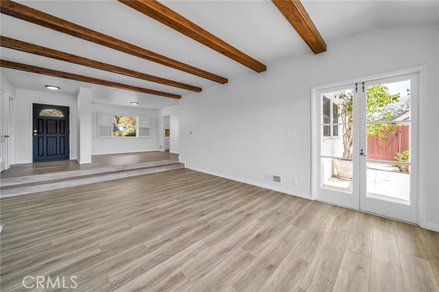 from the west corner of the living room - New front door and dining area  French Doors to a patio