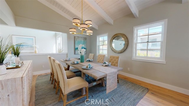 the formal dining room, light and airy with the exposed beam ceiling