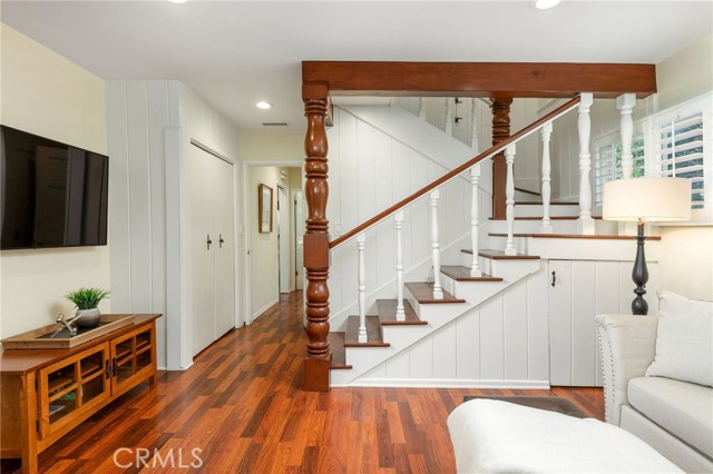 The rich wood detail at the staircase to the 2nd story's two bedrooms.