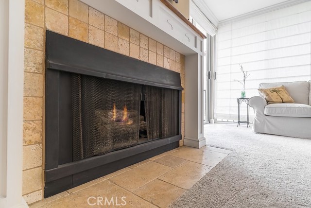 The spacious living room comes with a gas fireplace, which is surrounded with custom stone and a new wood mantel.  Fully equipped with a large flat screen TV with an above swing arm, recessed into the wall.