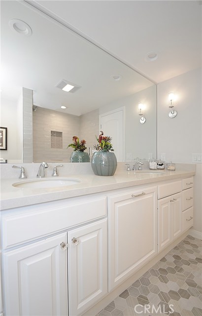 Hallway bathroom with double sinks