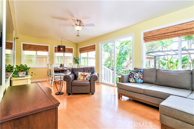 The spacious rear family room is surrounded by windows which look out onto lush landscaping.