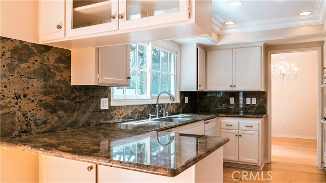 Kitchen with breakfast bar and granite countertops