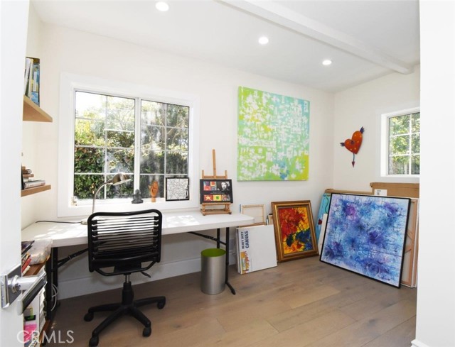 This bedroom has a closet but is used as the artist's workroom... sunny all day with the way this home is situated