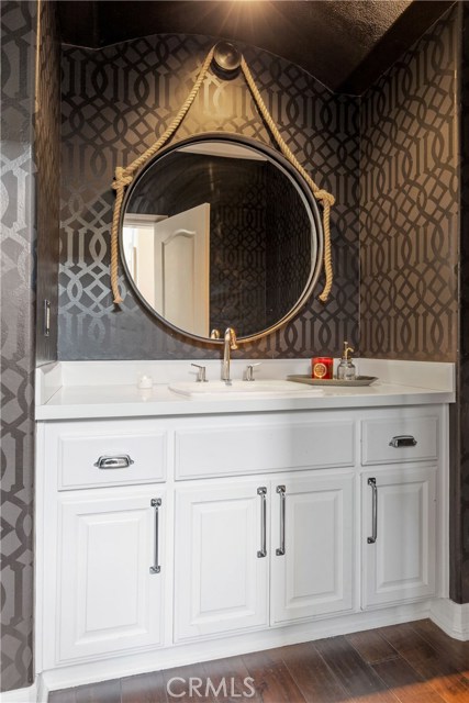 Gorgeous bathroom, Caesarstone countertop, Kelly Wearstler Designer wallpaper, restoration hardware fixtures.