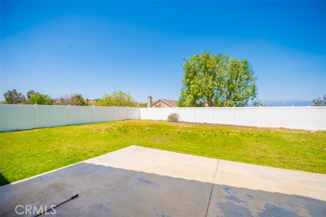 Pool size backyard with newly vinyl fence